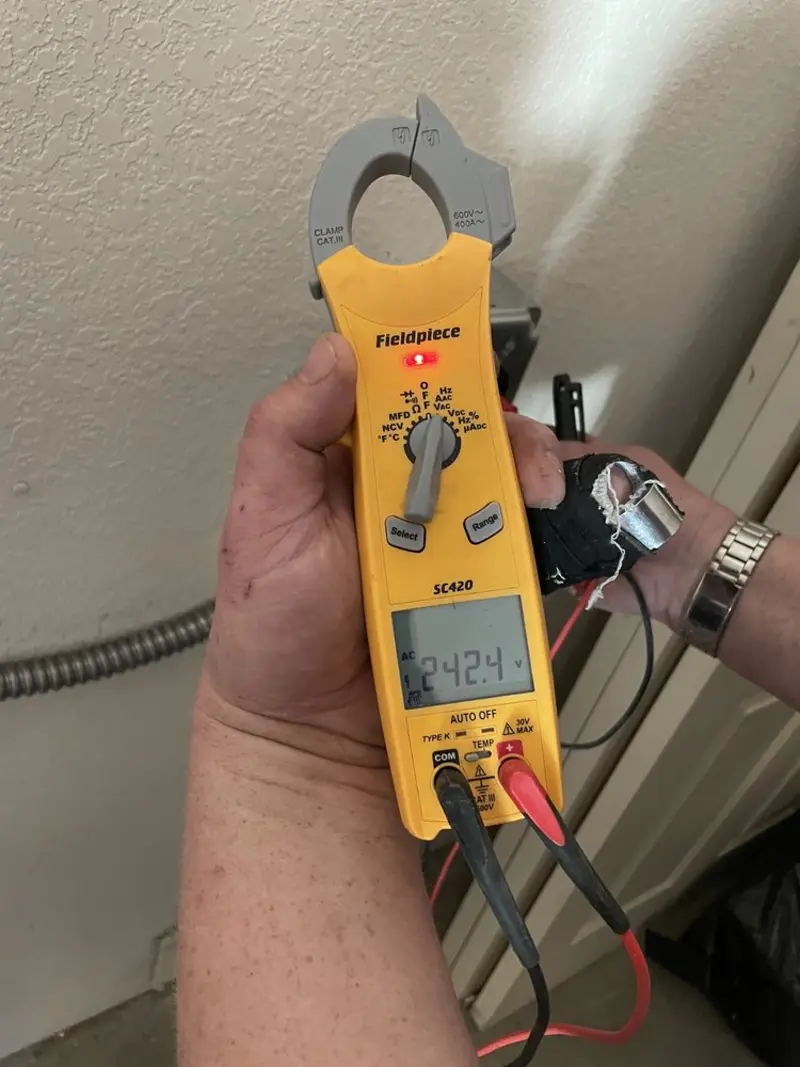 Voltage testing with clamp meter during Electrical Installation Services in North Miami Beach
